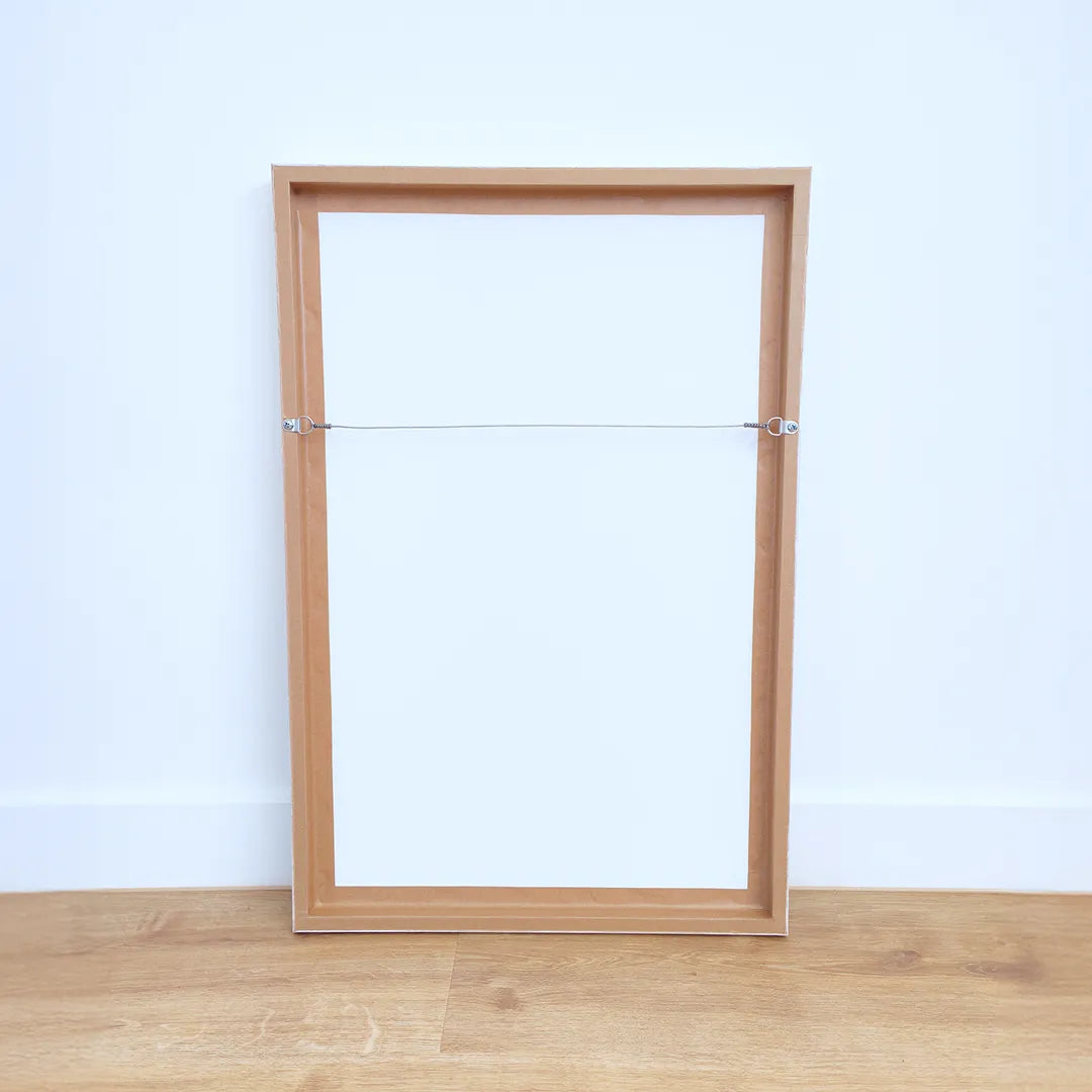 Back of printed and framed photo with wire attached at Print Frame Send