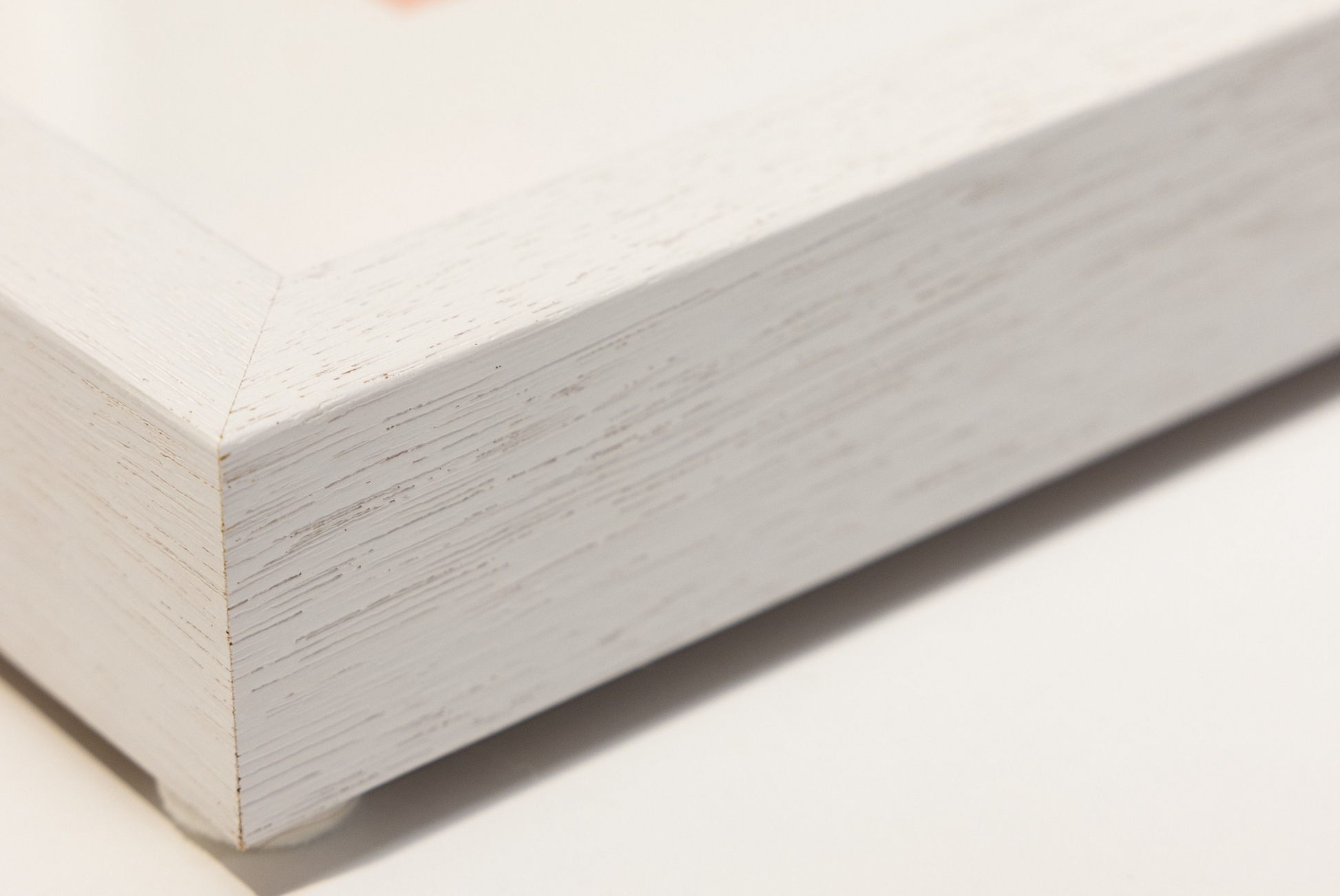 White timber photo frame on a plain background