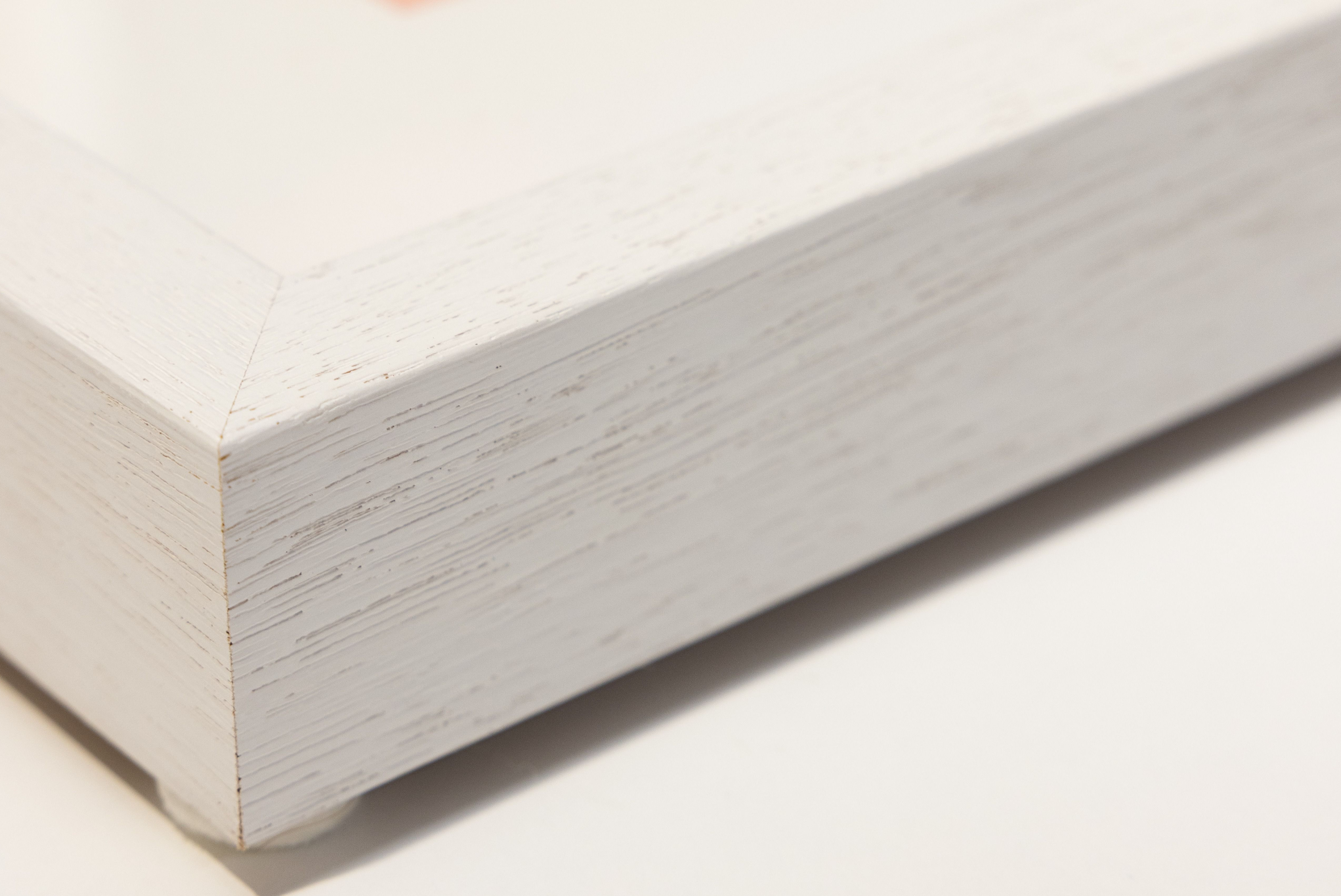 White timber photo frame on a plain background