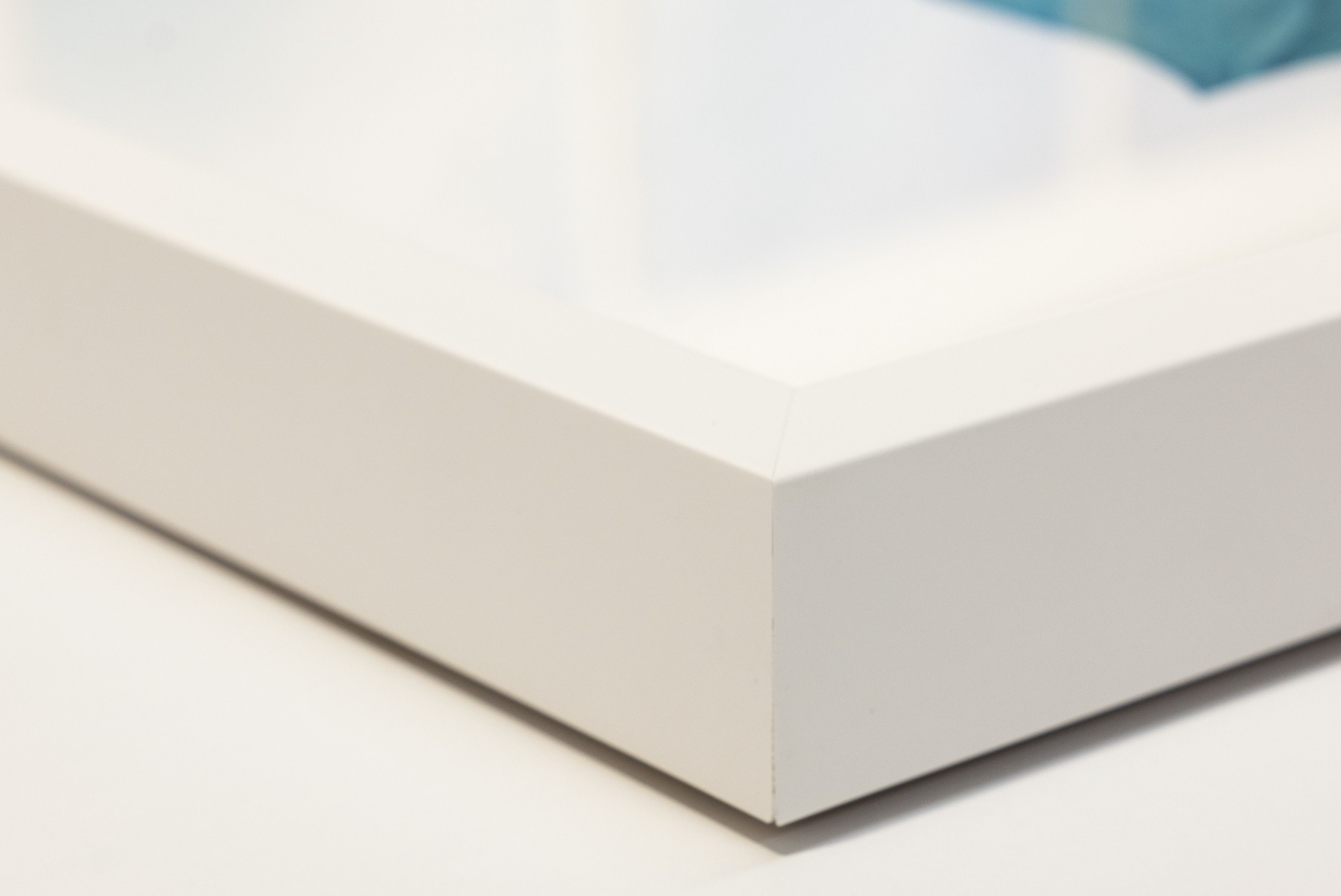 White photo frame on a plain background